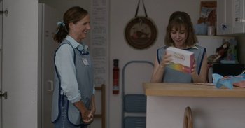 Movie still from “Horse Girl” (2020), directed by Jeff Baena – Two women standing at a counter in front of a counter; Medium shot, Over the shoulder angle