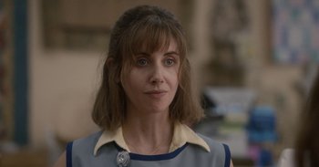 Movie still from “Horse Girl” (2020), directed by Jeff Baena – A person wearing a dress; Close Up shot, Over the shoulder angle