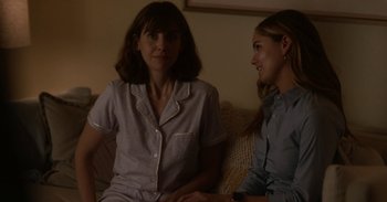 Movie still from “Horse Girl” (2020), directed by Jeff Baena – Two women are sitting on a couch and talking; Medium shot, Over the shoulder angle