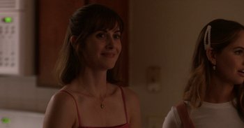 Movie still from “Horse Girl” (2020), directed by Jeff Baena – A woman in a pink top is looking at the camera; Close Up shot, Over the shoulder angle