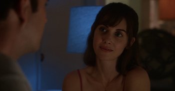 Movie still from “Horse Girl” (2020), directed by Jeff Baena – A beautiful woman sitting in front of a man; Close Up shot, Over the shoulder angle