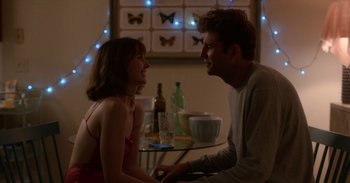 Movie still from “Horse Girl” (2020), directed by Jeff Baena – A man and a woman sitting at a table; Medium shot, Over the shoulder angle