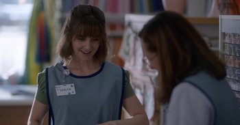 Movie still from “Horse Girl” (2020), directed by Jeff Baena – A woman standing next to another woman in a store; Medium shot, Over the shoulder angle