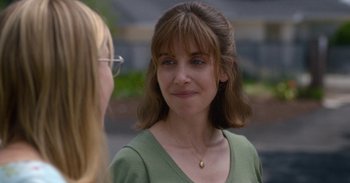 Movie still from “Horse Girl” (2020), directed by Jeff Baena – A woman in a green shirt talking to another woman; Close Up shot, Over the shoulder angle