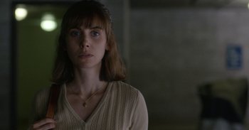 Movie still from “Horse Girl” (2020), directed by Jeff Baena – A young woman with blue eyes is looking at the camera; Close Up shot, Low angle