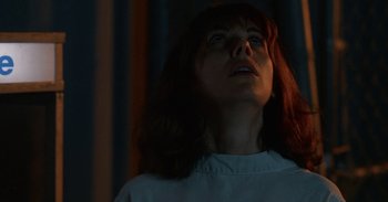 Movie still from “Horse Girl” (2020), directed by Jeff Baena – A woman looking up into the sky at night; Close Up shot, Low angle