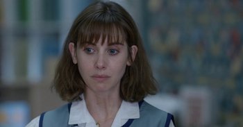 Movie still from “Horse Girl” (2020), directed by Jeff Baena – A person wearing a shirt; Close Up shot, Over the shoulder angle