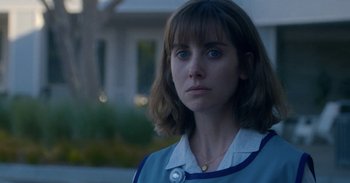 Movie still from “Horse Girl” (2020), directed by Jeff Baena – A person wearing a blue shirt; Close Up shot, Low angle