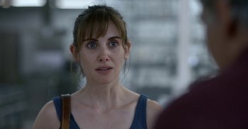 Movie still from “Horse Girl” (2020), directed by Jeff Baena – A person wearing a blue shirt; Close Up shot, Over the shoulder angle