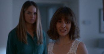 Movie still from “Horse Girl” (2020), directed by Jeff Baena – Two women standing next to each other in front of a wall; Close Up shot, Over the shoulder angle