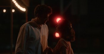 Movie still from “Horse Girl” (2020), directed by Jeff Baena – A man and a woman standing next to each other in the dark; Medium shot, Over the shoulder angle