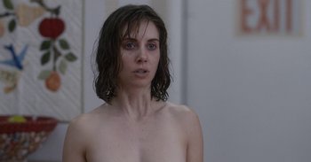 Movie still from “Horse Girl” (2020), directed by Jeff Baena – A woman with wet hair is standing naked; Close Up shot, Over the shoulder angle