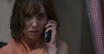 Movie still from “Horse Girl” (2020), directed by Jeff Baena – A person talking on a cell phone; Close Up shot, Over the shoulder angle