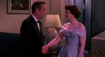 Movie still from “The Barefoot Contessa” (1954), directed by Joseph L. Mankiewicz – A man and a woman holding each other's hands; Medium shot, Over the shoulder angle