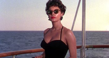 Movie still from “The Barefoot Contessa” (1954), directed by Joseph L. Mankiewicz – A woman in a black bathing suit on a boat in the ocean; Medium shot, Low angle