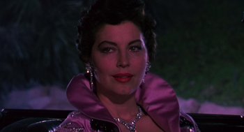 Movie still from “The Barefoot Contessa” (1954), directed by Joseph L. Mankiewicz – A person wearing a purple jacket; Close Up shot, Low angle