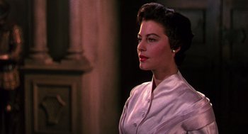 Movie still from “The Barefoot Contessa” (1954), directed by Joseph L. Mankiewicz – A woman with short hair wearing a white shirt; Close Up shot, Low angle