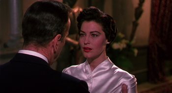 Movie still from “The Barefoot Contessa” (1954), directed by Joseph L. Mankiewicz – A man and a woman are talking to each other; Close Up shot, Over the shoulder angle