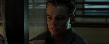 Movie still from “The Beach” (2000), directed by Danny Boyle – A person wearing a shirt; Close Up shot, Low angle