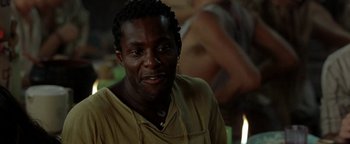 Movie still from “The Beach” (2000), directed by Danny Boyle – A person wearing a yellow shirt; Close Up shot, Over the shoulder angle
