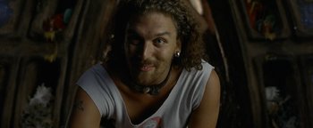 Movie still from “The Beach” (2000), directed by Danny Boyle – A person wearing a shirt; Close Up shot, Low angle