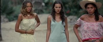 Movie still from “The Beach” (2000), directed by Danny Boyle – Two young women standing on a dirt road; Medium shot, Low angle