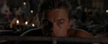 Movie still from “The Beach” (2000), directed by Danny Boyle – A person with his eyes wide open; Close Up shot, Over the shoulder angle
