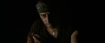 Movie still from “The Beach” (2000), directed by Danny Boyle – A person with a bandana on; Close Up shot, High angle