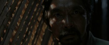 Movie still from “The Beach” (2000), directed by Danny Boyle – A person with a beard; Extreme Close Up shot, Over the shoulder angle