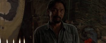 Movie still from “The Beach” (2000), directed by Danny Boyle – A person wearing a shirt; Close Up shot, Over the shoulder angle