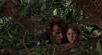 Movie still from “The Beguiled” (1971), directed by Don Siegel – A man and a woman in the woods with blood on their faces; Close Up shot, Low angle