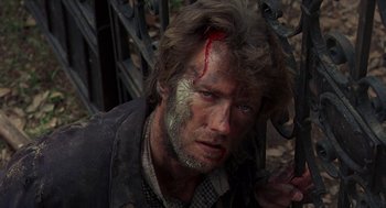 Movie still from “The Beguiled” (1971), directed by Don Siegel – A person with blood on his face; Close Up shot, High angle