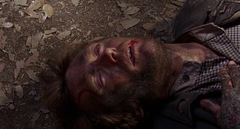 Movie still from “The Beguiled” (1971), directed by Don Siegel – A person laying on the ground; Close Up shot, Overhead angle