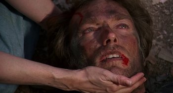 Movie still from “The Beguiled” (1971), directed by Don Siegel – A man with blood all over his face and hands; Close Up shot, Over the shoulder angle