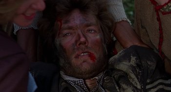 Movie still from “The Beguiled” (1971), directed by Don Siegel – A person with blood all over his face; Close Up shot, Overhead angle