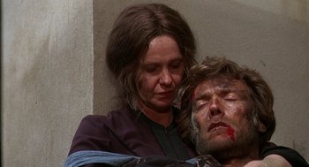 Movie still from “The Beguiled” (1971), directed by Don Siegel – A woman holding a man's face with blood on it; Close Up shot, Low angle