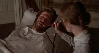Movie still from “The Beguiled” (1971), directed by Don Siegel – A woman is brushing her teeth while a man lies in bed; Close Up shot, Over the shoulder angle