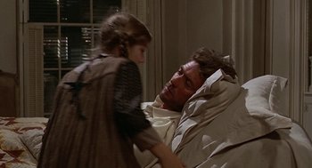 Movie still from “The Beguiled” (1971), directed by Don Siegel – A man and a little girl are in a room; Medium shot, Over the shoulder angle