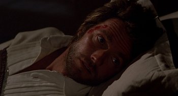 Movie still from “The Beguiled” (1971), directed by Don Siegel – A person laying in a bed; Close Up shot, High angle