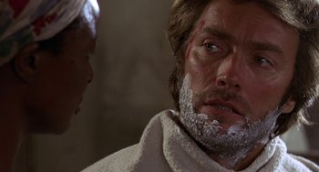 Movie still from “The Beguiled” (1971), directed by Don Siegel – A person with shaving cream on his face; Close Up shot, Over the shoulder angle
