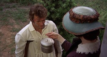Movie still from “The Beguiled” (1971), directed by Don Siegel – A man and a woman holding a tea pot; Medium shot, Overhead angle