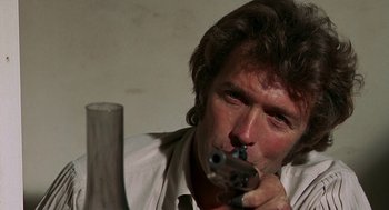 Movie still from “The Beguiled” (1971), directed by Don Siegel – A person holding a gun; Close Up shot, Low angle