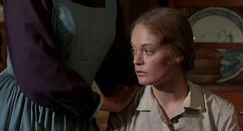 Movie still from “The Beguiled” (1971), directed by Don Siegel – A young woman looking down at her face; Close Up shot, Over the shoulder angle