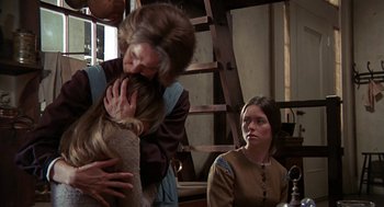 Movie still from “The Beguiled” (1971), directed by Don Siegel – Two women and a man in medieval garb; Medium shot, Over the shoulder angle