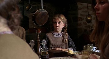 Movie still from “The Beguiled” (1971), directed by Don Siegel – A young girl sitting at a table in front of a mirror; Medium shot, Over the shoulder angle