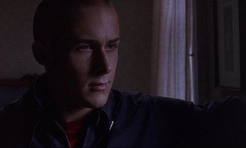 Movie still from “The Believer” (2001), directed by Henry Bean – A person wearing a shirt; Close Up shot, Low angle