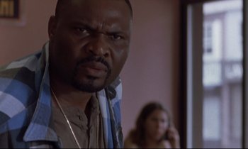 Movie still from “The Believer” (2001), directed by Henry Bean – A person with a cell phone; Close Up shot, Low angle