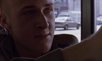 Movie still from “The Believer” (2001), directed by Henry Bean – A person looking out of a car window; Close Up shot, Low angle