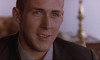 Movie still from “The Believer” (2001), directed by Henry Bean – A person wearing a suit and tie; Close Up shot, Over the shoulder angle