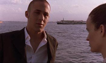 Movie still from “The Believer” (2001), directed by Henry Bean – A man standing in front of a body of water; Close Up shot, Low angle